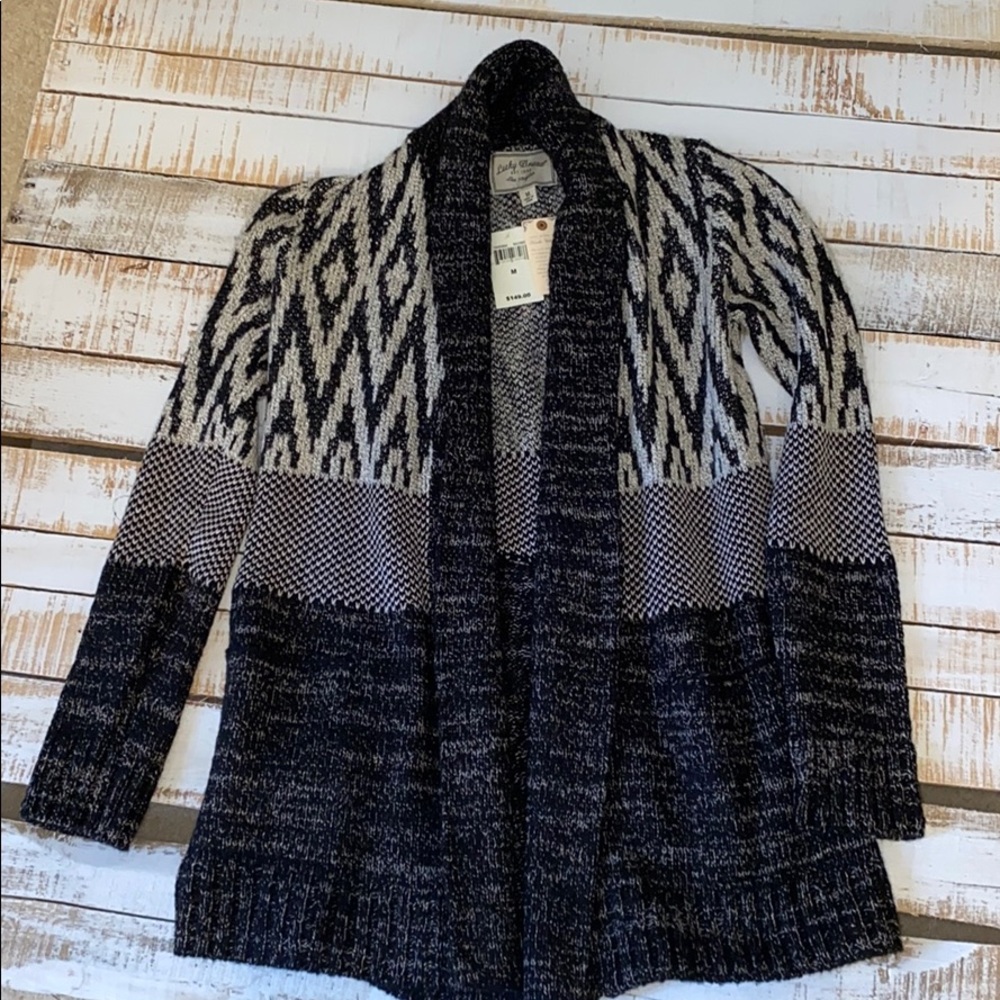 Women’s Black cardigan.
